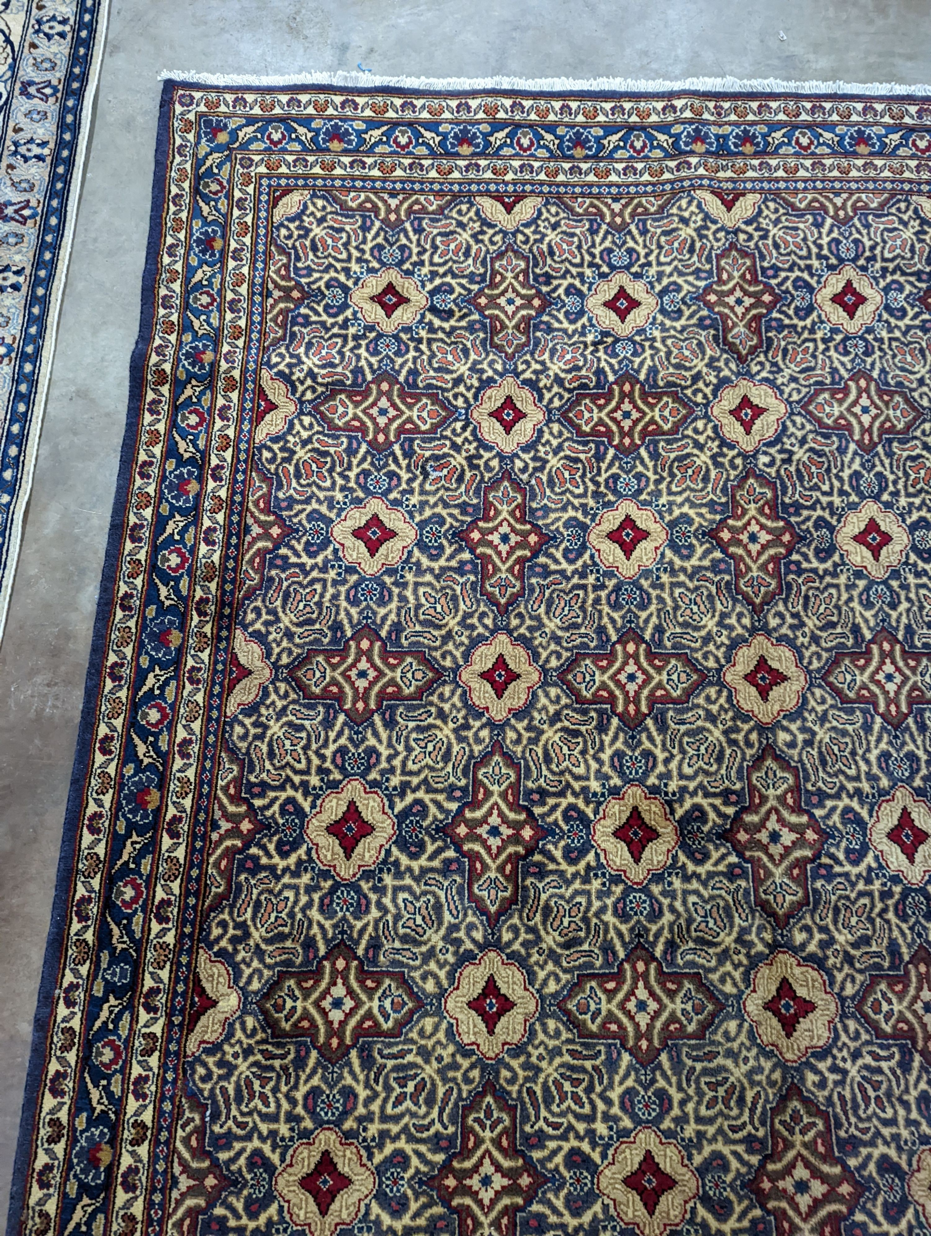 A meshed blue ground carpet, 290 x 190cm